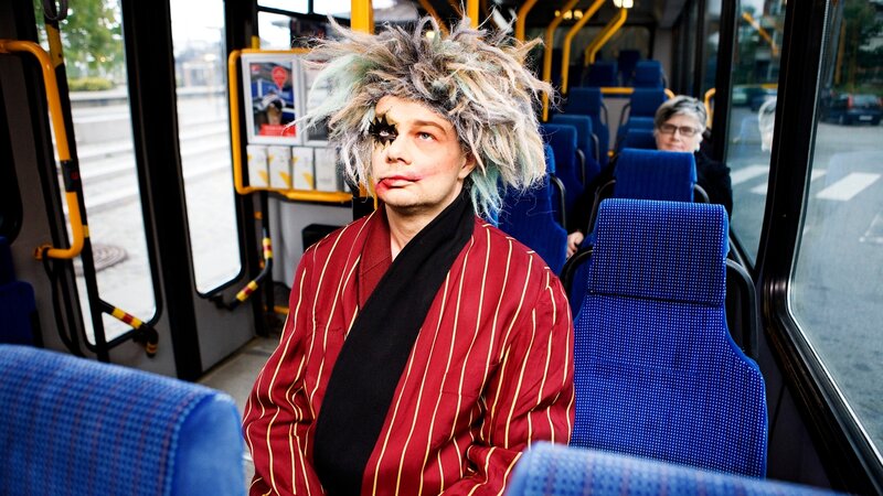 person in costume on bus
