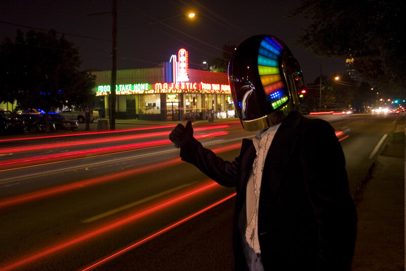 person in daft punk helmet at night