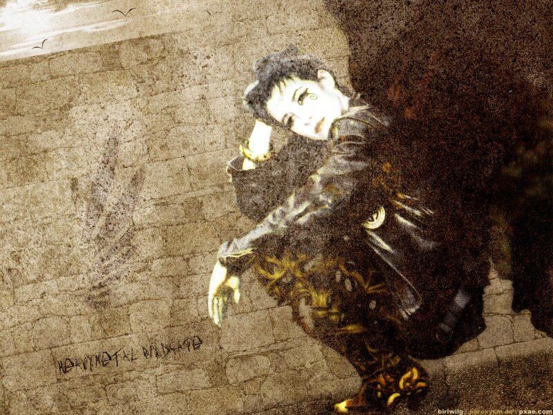 person in dark clothing on wall