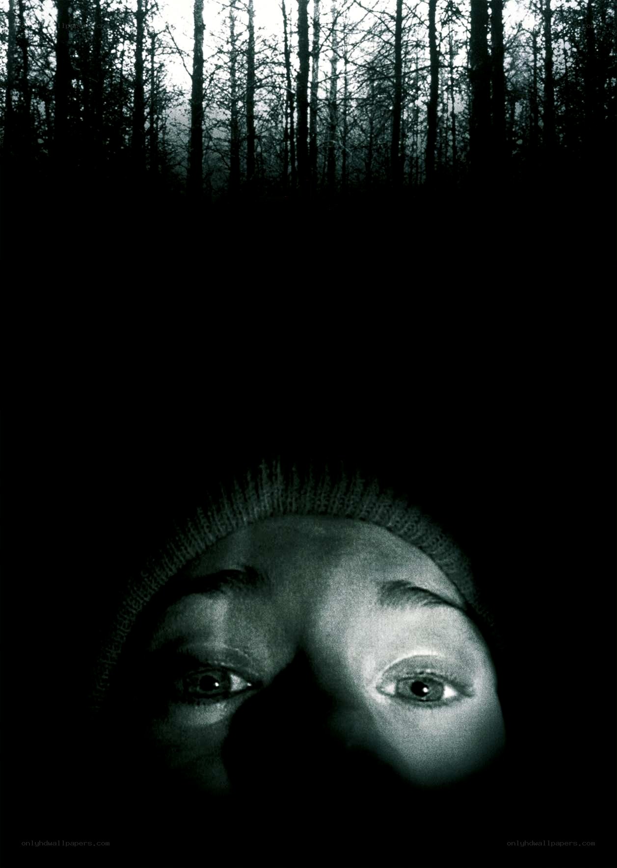 person in dark forest