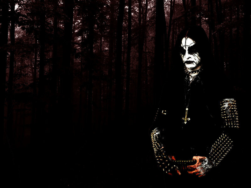 person in dark forest with face paint