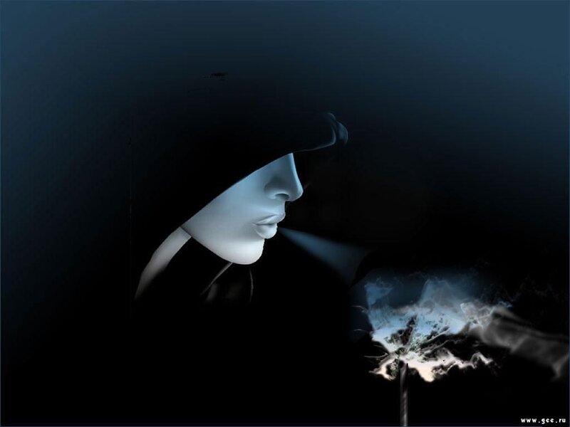 person in dark hood with glowing flower