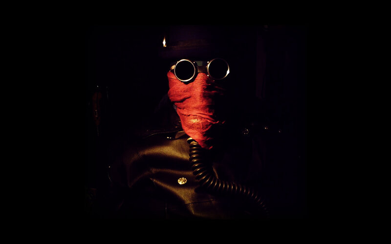 person in dark mask and goggles
