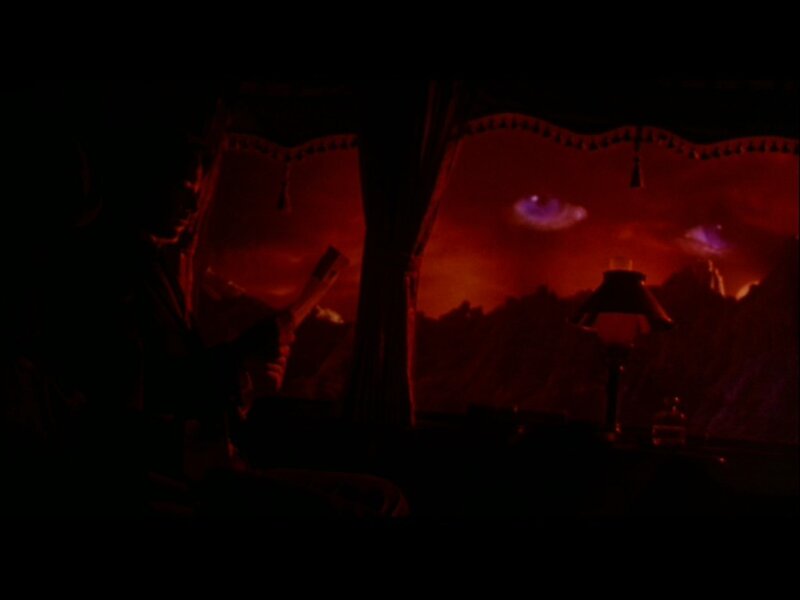 Person in Dark Room — Red
