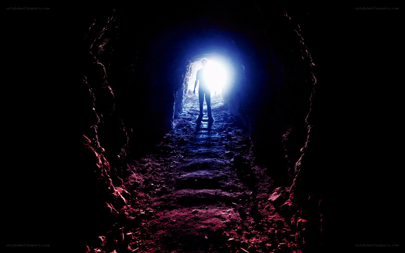 person in dark tunnel
