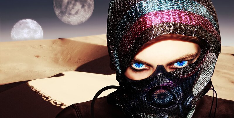 person in desert with two moons