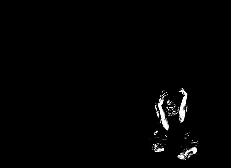 person in distress on black background