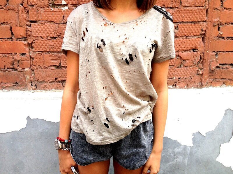 person in distressed t-shirt