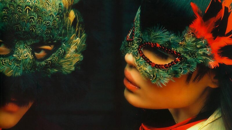 Person in Feather Mask