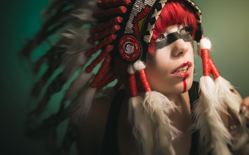 person in feathered headdress