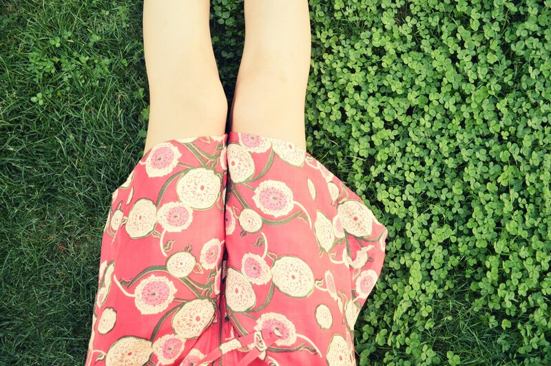 person in floral dress on grass