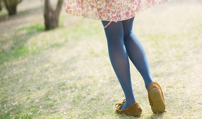 person in floral dress walking