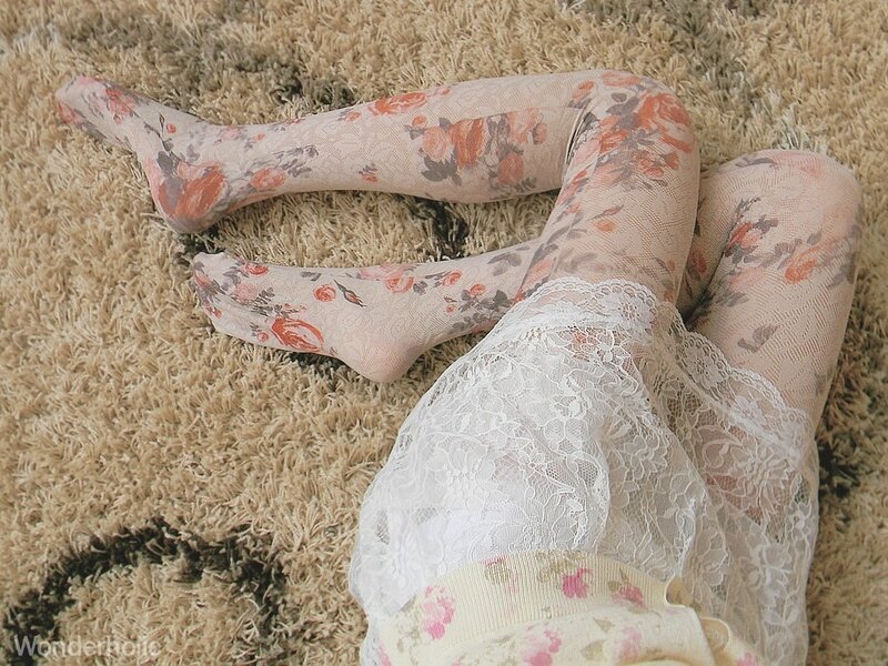 person in floral tights on carpet