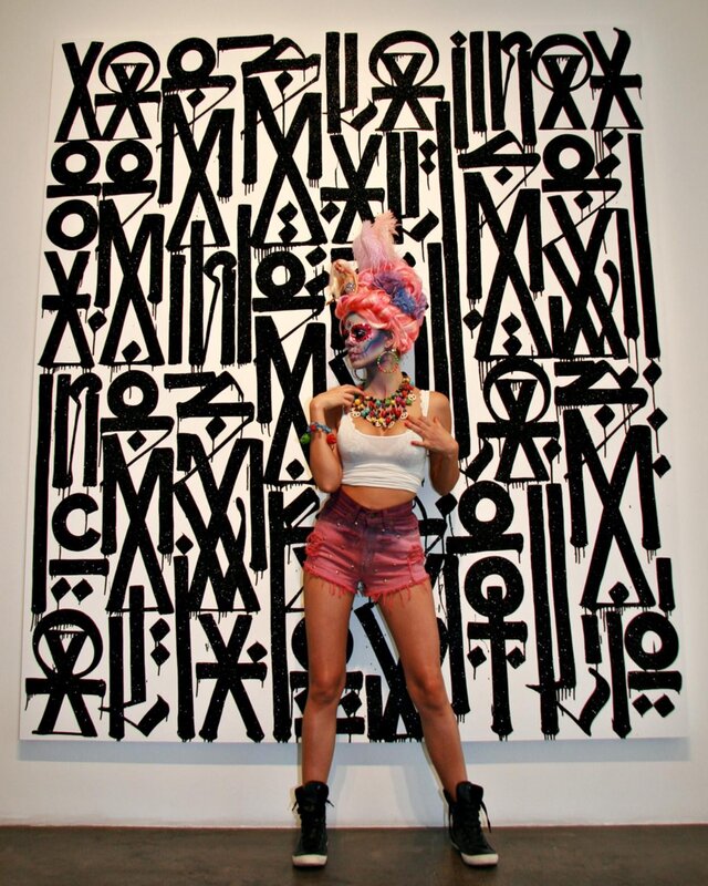 person in front of abstract art