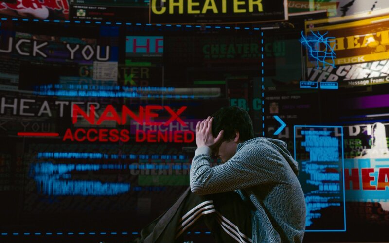 person in front of digital screen