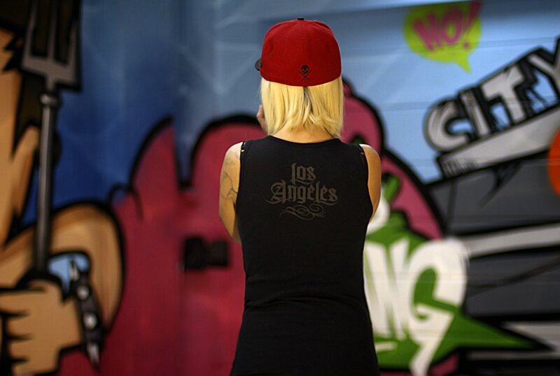 Person in front of graffiti wall