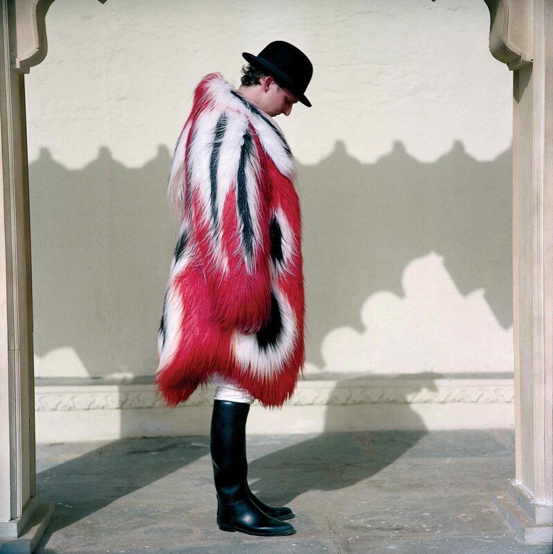 person in fur coat and hat