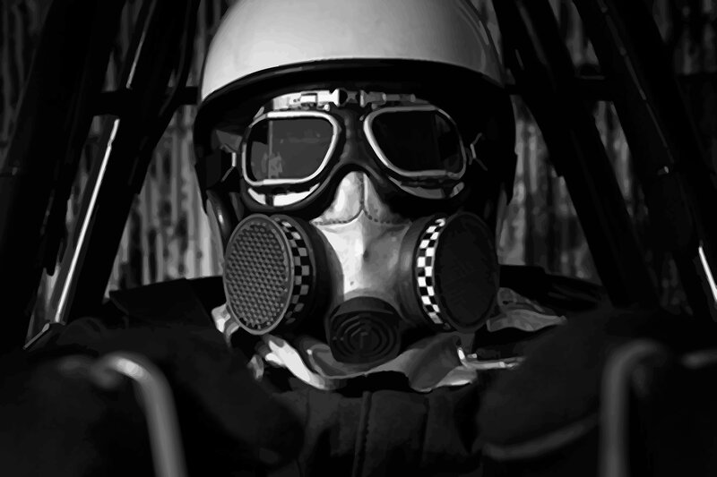 person in gas mask and helmet