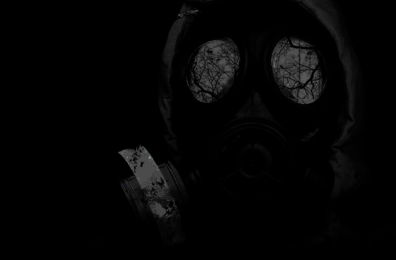 person in gas mask at night