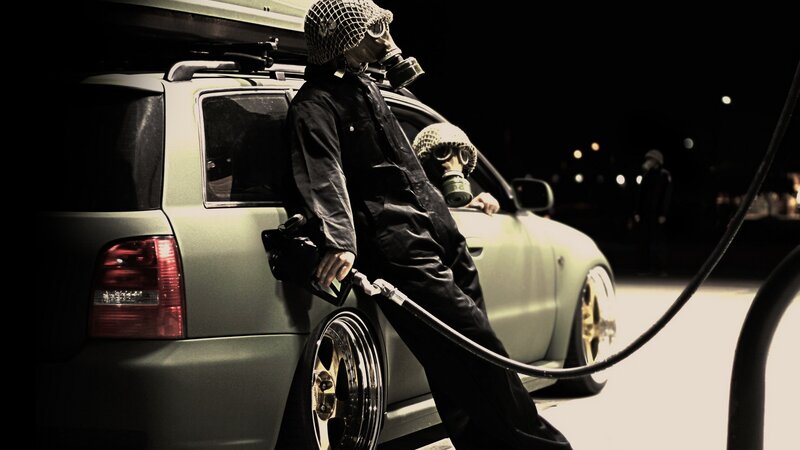person in gas mask at night