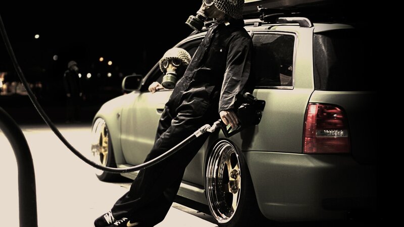 Person in Gas Mask at Pump