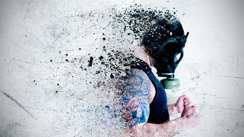 person in gas mask disintegrating