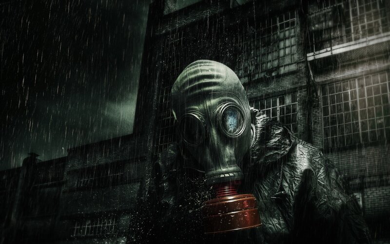 person in gas mask in rain