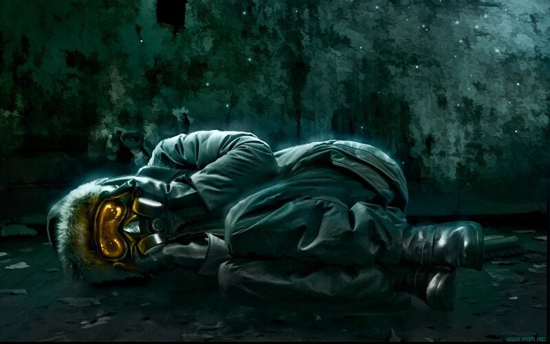 person in gas mask lying down