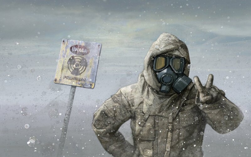 person in gas mask making peace sign