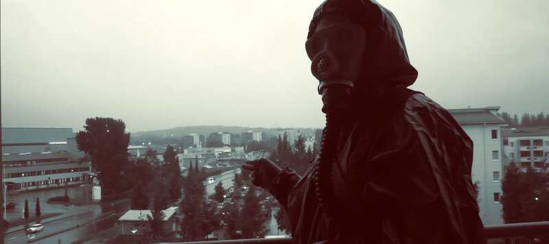 person in gas mask on balcony