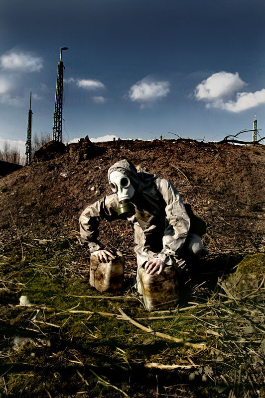 person in gas mask on hill