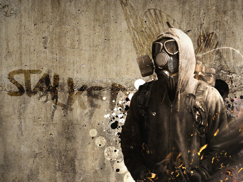 person in gas mask with graffiti