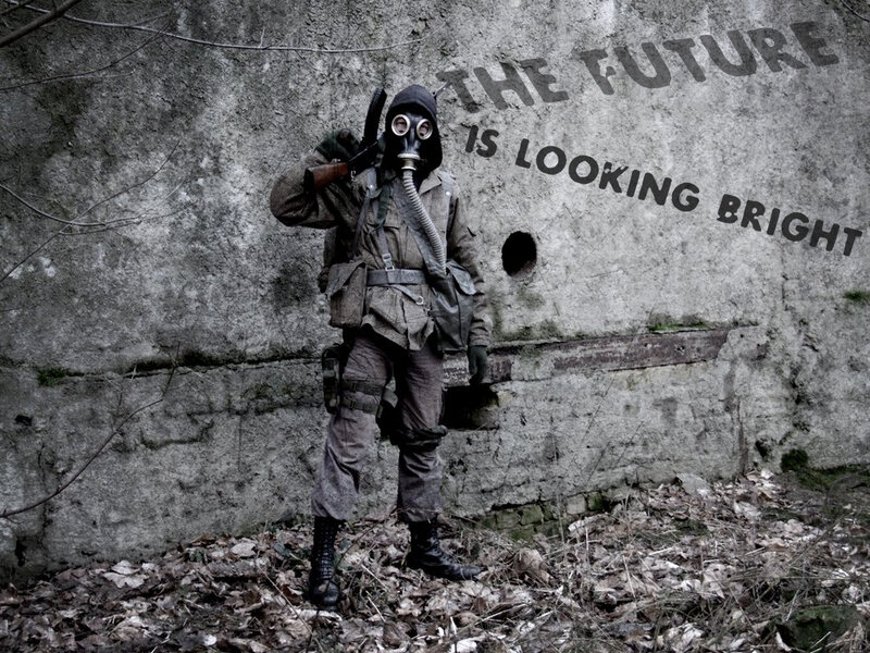 person in gas mask with rifle