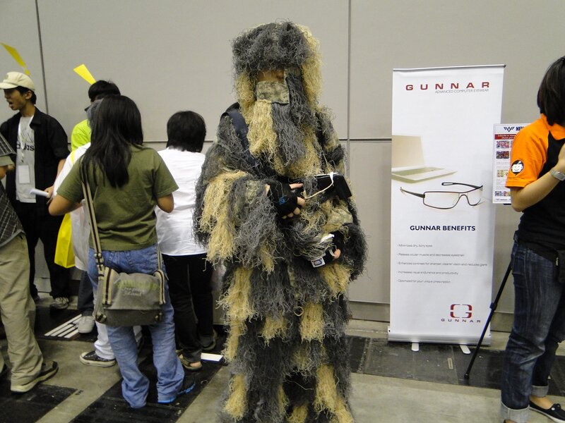Person in ghillie suit at event