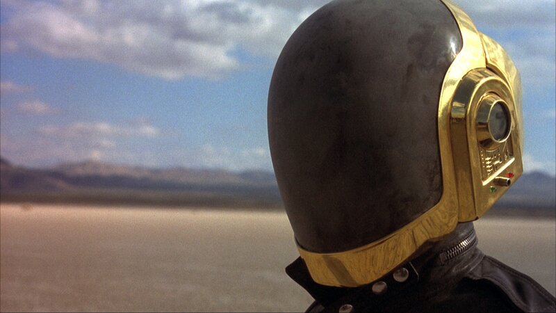 person in gold helmet in desert