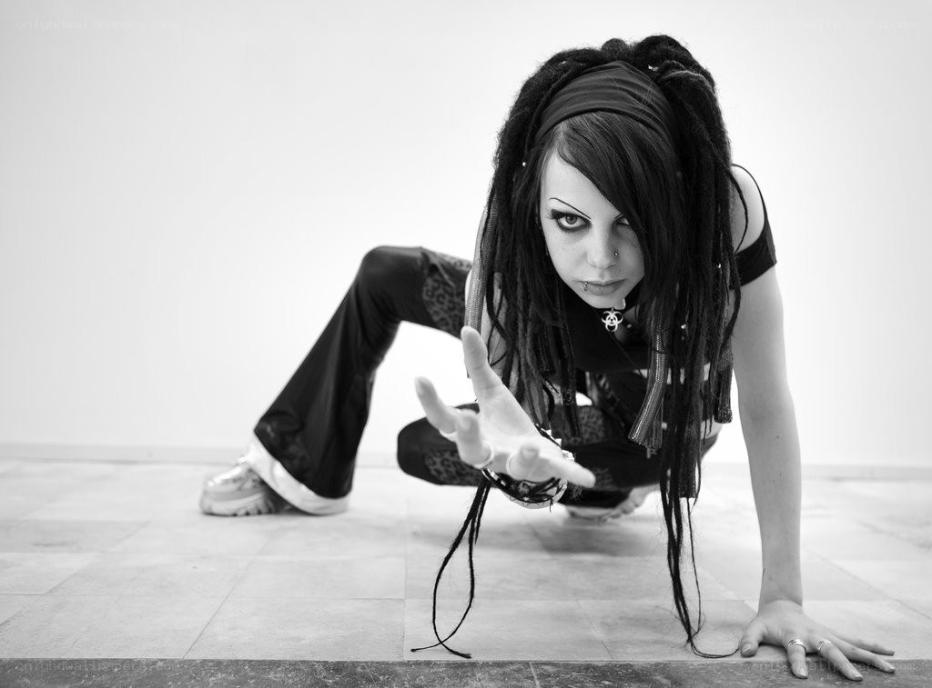person in goth pose on floor