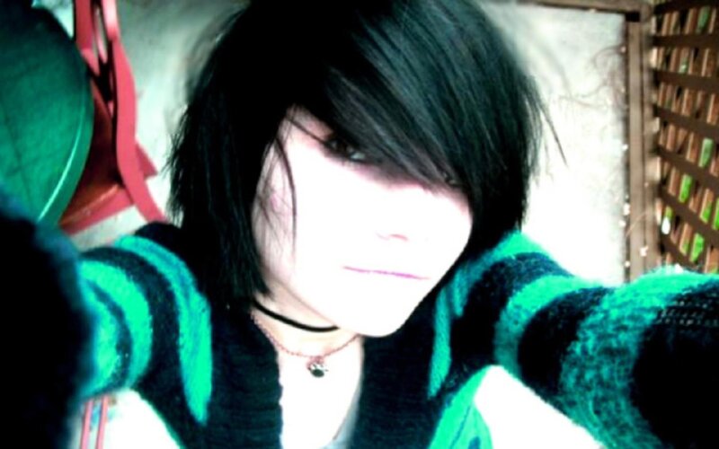 person in green and black sweater