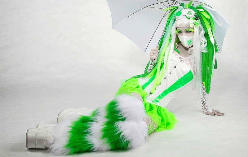 Person in Green and White Costume — Dramatic