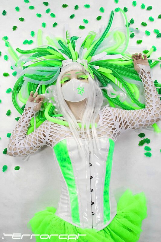person in green and white costume
