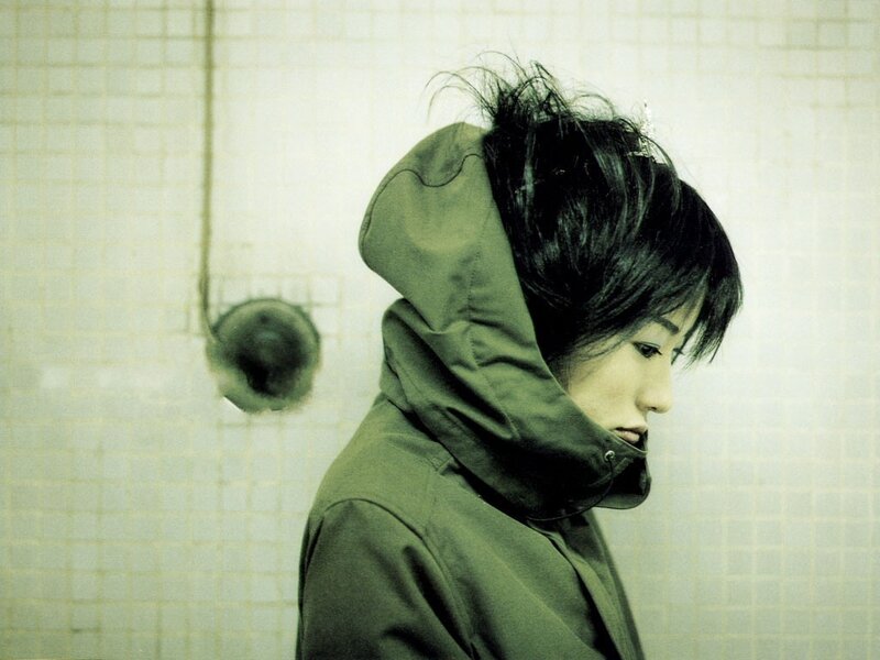 person in green hooded jacket