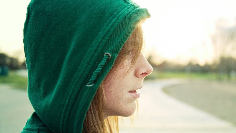 person in green hoodie