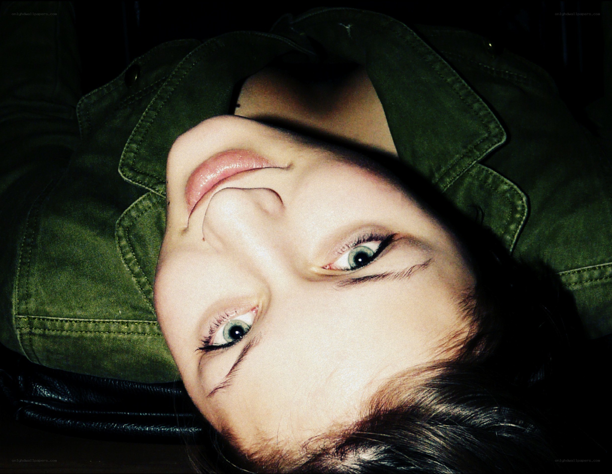 person in green jacket lying down