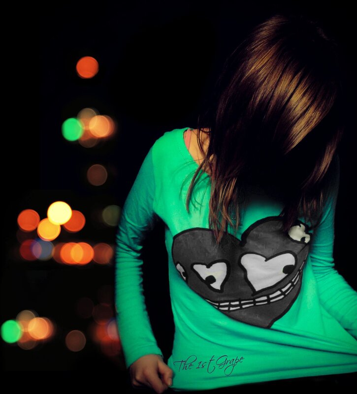 person in green shirt at night