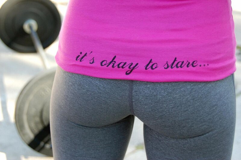person in gym with text on shirt