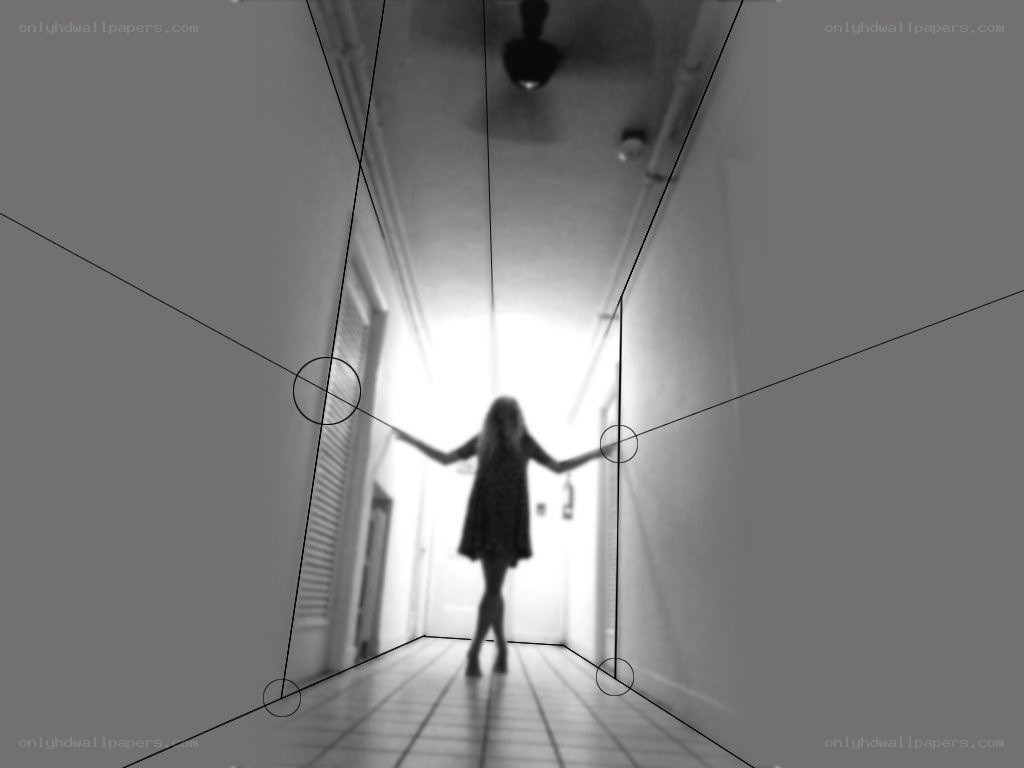 person in hallway with perspective lines