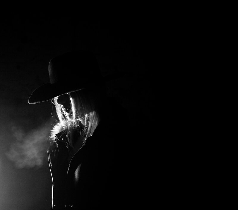 Person in Hat and Smoke