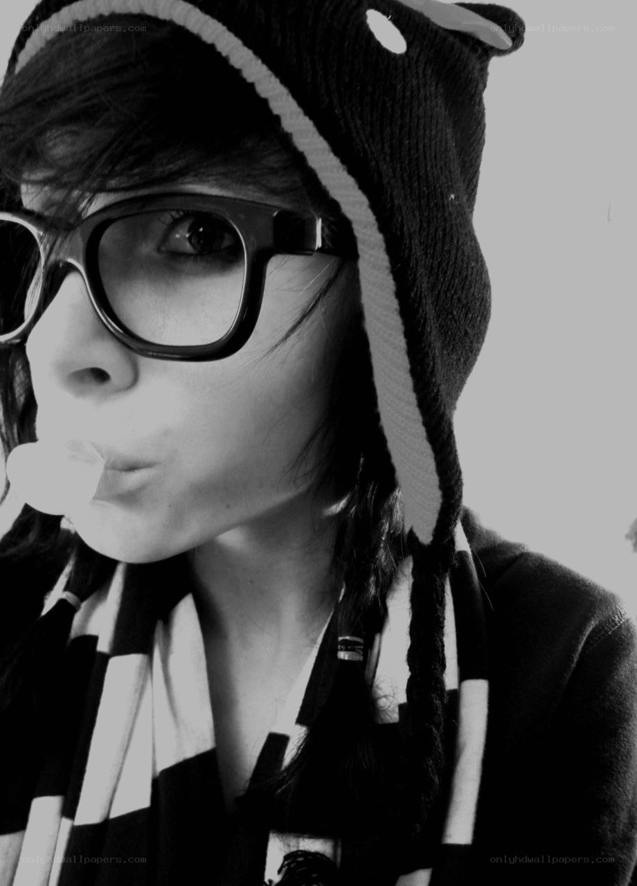 person in hat blowing bubble