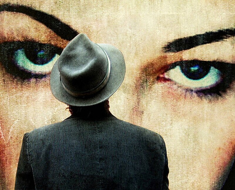 Person in Hat Facing Mural