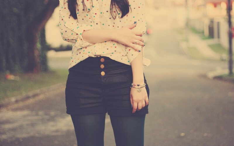 person in heart-print shirt