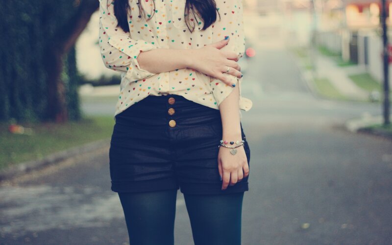 person in heart-print shirt